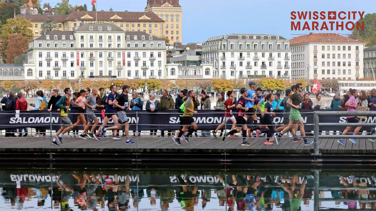 Personen vom Marathon vor dem Luzerner Seeufer